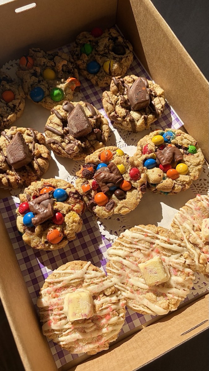 An Auggies Cookie Grazing Box filled with loaded cookies topped with chocolate, candy and white chocolate, ready for a Barossa birthday party
