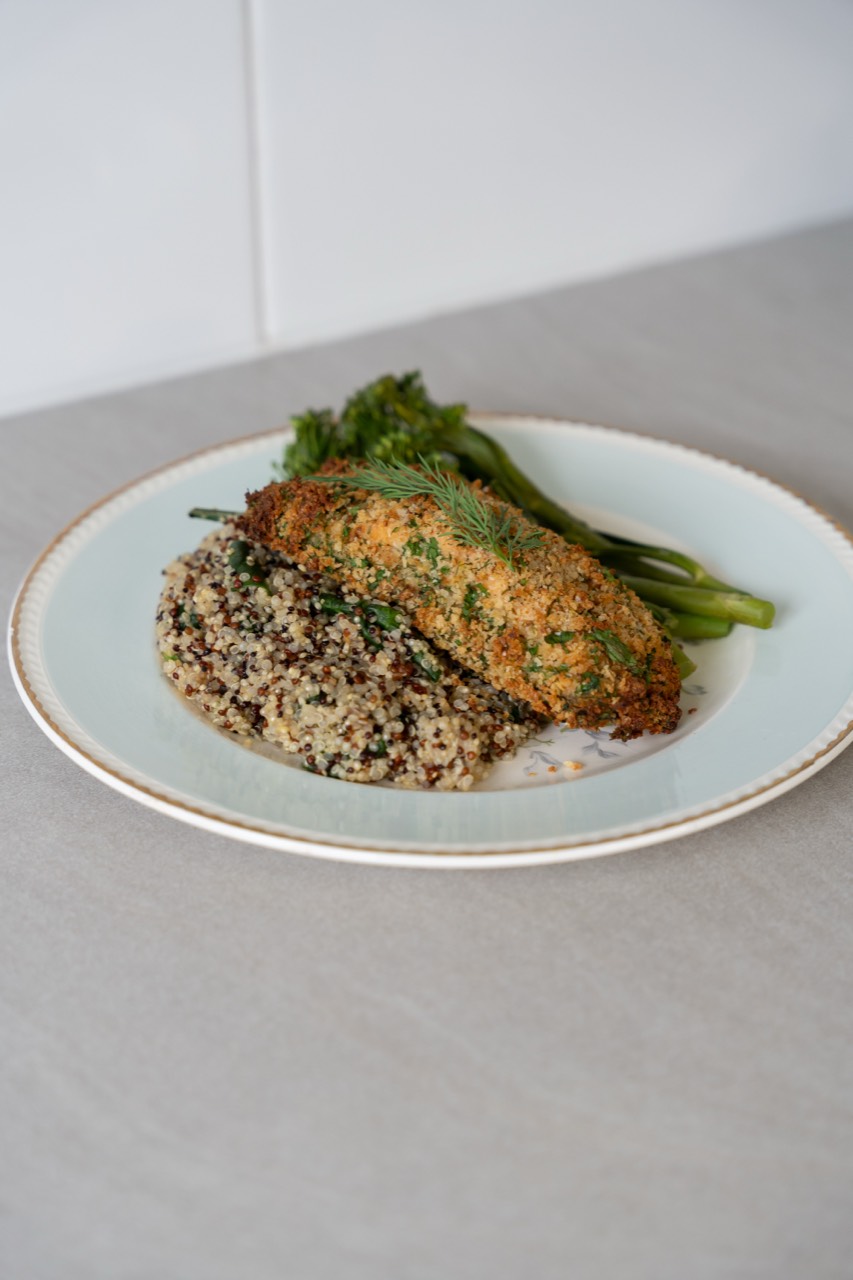 Herb-crumbed chicken on quinoa with broccolini, plated