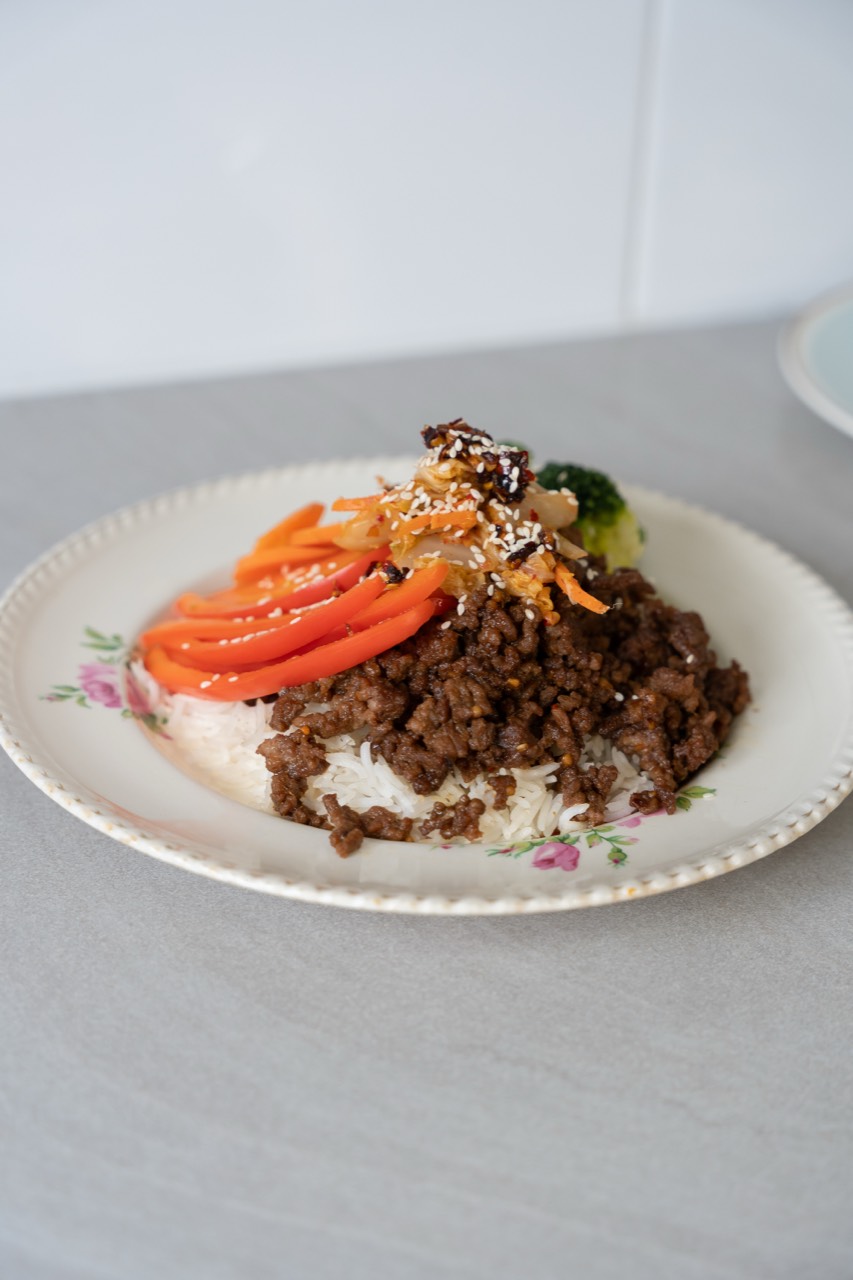 Korean-style beef bowl with rice, peppers and toasted sesame